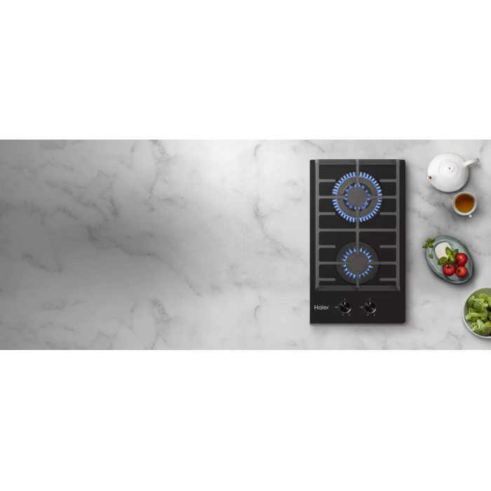 Газовая варочная поверхность Haier HHX-G32CWLB с чугунными решетками, LED индикаторами и интегрированным электроподжигом для удобства использования.